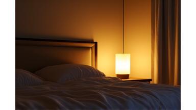 Soft, warm light spilling into a bedroom at dusk, creating a tranquil atmosphere for sleep.